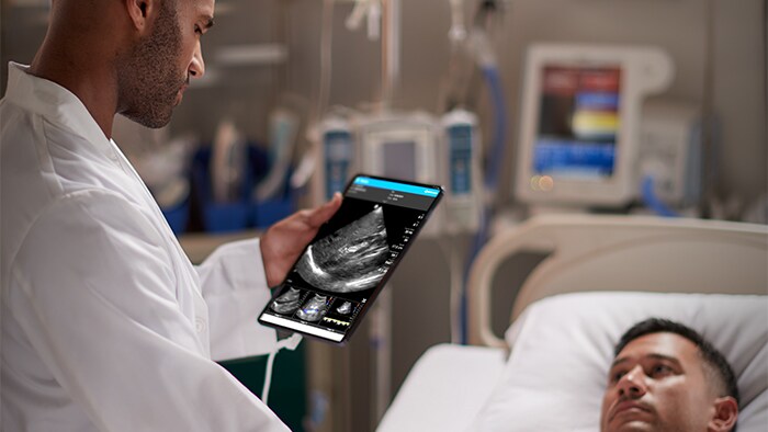 Patient being examined with Lumify handheld ultrasound