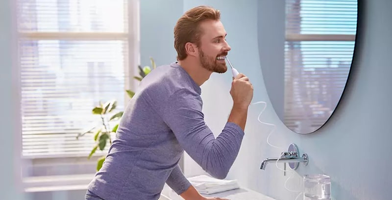 men using power flosser