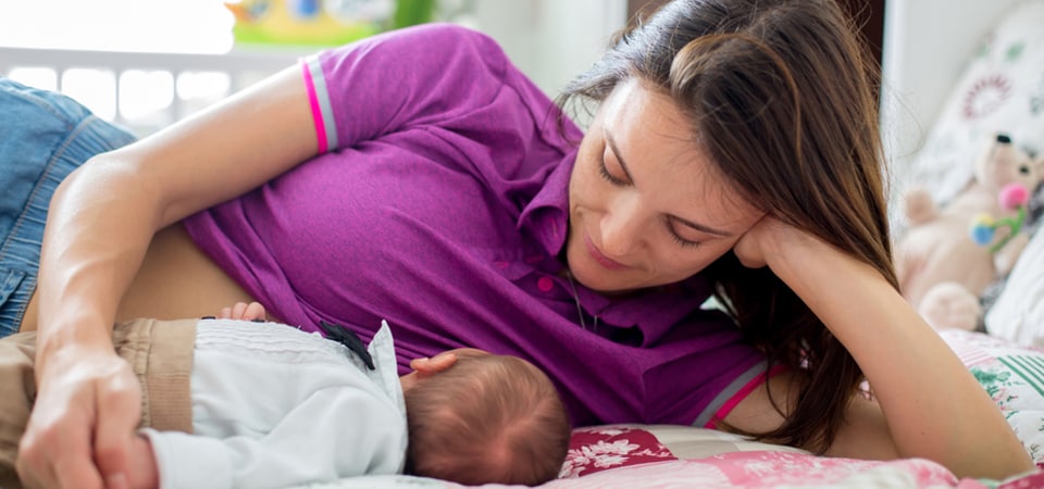 women feeding baby