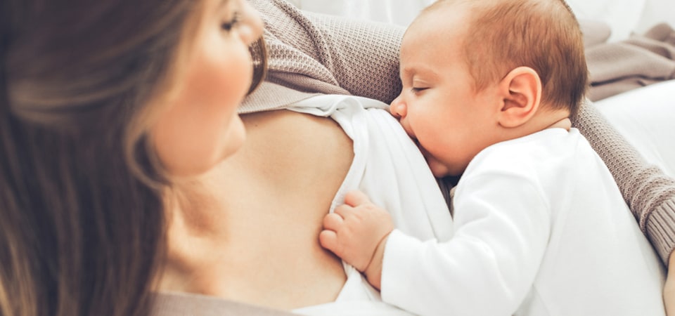 women feeding baby