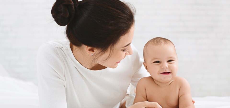 mother looking at the baby