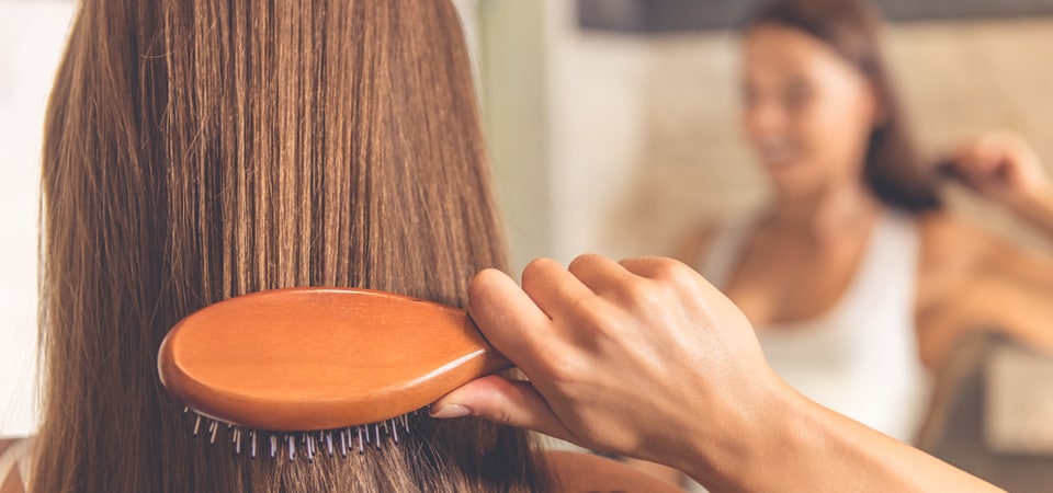 girl combing hair